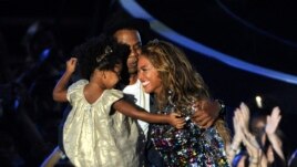 Beyonce, Jay Z and their daughter Blue Ivy. (Photo by Chris Pizzello/Invision/AP)