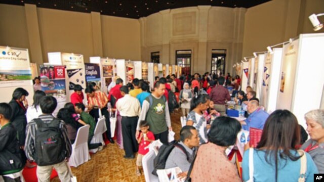 Students visit recruiters from US universities seeking answers to questions about studying abroad, at a US education fair sponsored by the US Embassy in Jakarta, April 4, 2011