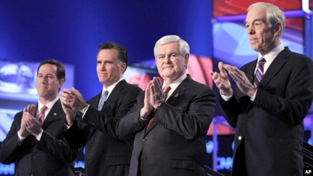 Republican presidential candidates, former Pennsylvania Sen. Rick Santorum, former Massachusetts Gov. Mitt Romney, former House Speaker Newt Gingrich and Rep. Ron Paul, R-Texas, take the stage before the start of the Republican presidential candidate deba