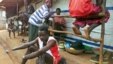 Victims of mutilations perpetrated by rebels of the Revolutionary United Front (RUF) gather at the Handicap International camp in Freetown, May 18, 2000. (AFP) 