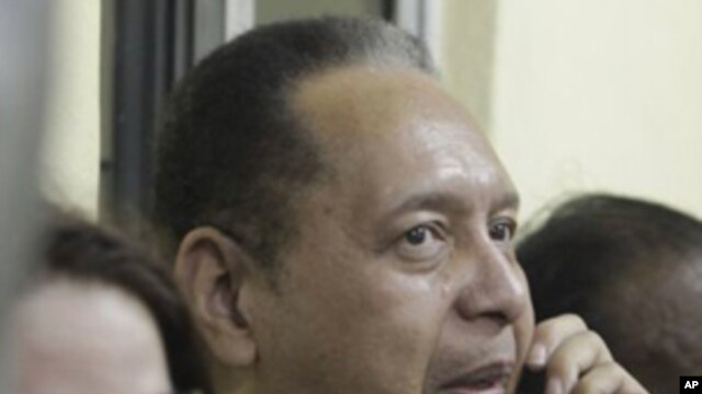 Jean Claude Duvalier and his wife, at Haiti's international airport, 16 Jan 2011