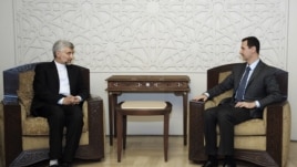 Iran's Supreme National Security Council, Saeed Jalili, meets with Syrian President Bashar Assad in Damascus, Syria, Aug. 7, 2012.  (SANA)