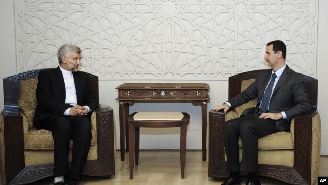 Iran's Supreme National Security Council, Saeed Jalili, meets with Syrian President Bashar Assad in Damascus, Syria, Aug. 7, 2012.  (SANA)