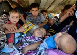 Refugees arrive at Sulaimaniya province, Iraq, Aug. 8, 2014.