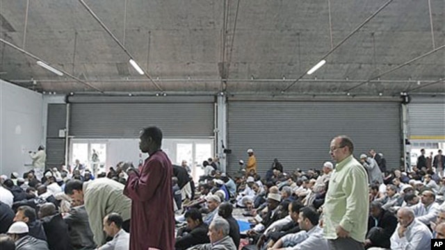 French Muslims attend a mass prayer at a prayer hall in a unused former fire station, Paris, September 16, 2011.