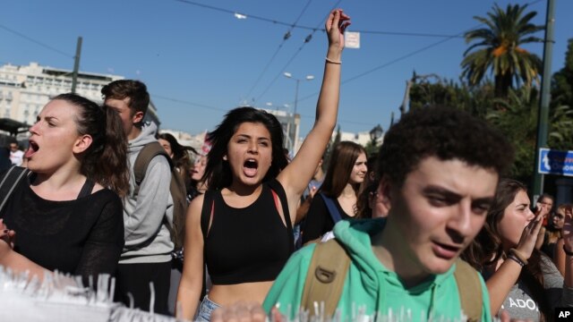 Students chant slogans as they protest during a 24-hour nationwide general strike in Athens, Nov. 12, 2015.