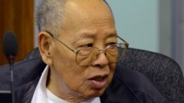 In this photo released by the Extraordinary Chambers in the Courts of Cambodia, Ieng Sary, the Khmer Rouge's former foreign minister, listens to testimony being given during his trial at the U.N.-backed war crimes tribunal in Phnom Penh, file photo. 