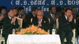 Cambodian Prime Minister Hun Sen, right, prays with President of the Cambodian National Assembly Heng Samrin, left, and Senate President Chea Sim, center, during a celebration marking the 34th anniversary of the 1979 downfall of the Khmer Rouge regime, in Phnom Penh, Cambodia, Monday, Jan. 7, 2013. (AP Photo/Heng Sinith)