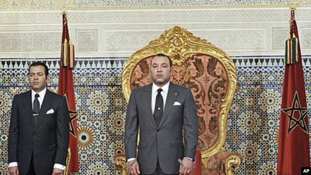 Morocco's King Mohammed (R), shown here as he prepared to address the nation on June 17, 2011, is under pressure to guarantee a greater separation of power in the kingdom