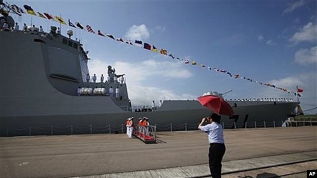 Visitor photographs missile destroyer Haikou 171, Hong Kong, April 30, 2012.