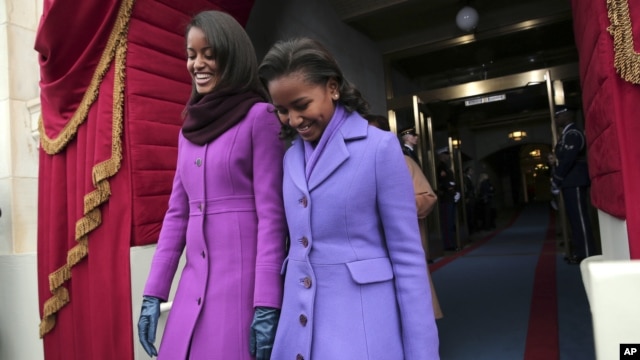 President Barack Obama's daughters Malia Obama, left, and Sasha Obama arrive on the West Front of the Capitol in Washington, Monday, Jan. 21, 2013, for the president's ceremonial swearing-in.