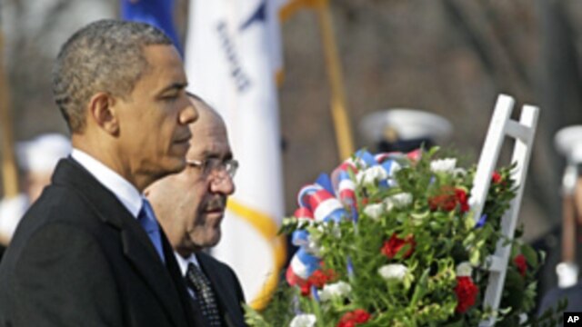 President Barack Obama and Iraq's PM Nouri al-Maliki lay a wreath at the Tomb of the Unknowns, Monday,  at Arlington National Cemetery in Arlington, Virginia, Dec. 12, 2011