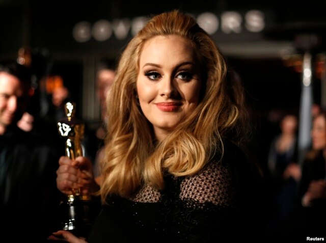 FILE - Singer Adele, winner of the Oscar for best original song for "Skyfall," is interviewed at the Governors Ball for the 85th Academy Awards in Hollywood, California.