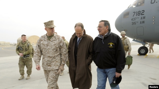 Defense Secretary Leon Panetta (R) talks with U.S. Ambassador to Afghanistan James B. Cunningham (C) and Marine General John R. Allen, commander of International Security Assistance Force, upon arriving at Kabul International Airport, December 12, 2012.