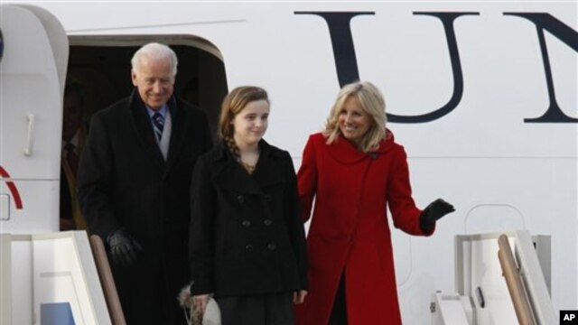 Vice President of the United States Joe Biden,  left, granddaughter Finnegan and wife Jill, right, arrive at Vnukovo airport outside  Moscow,  Russia, March 8, 2011