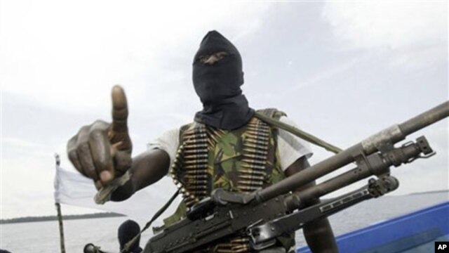 Militants patrol the creeks of the Niger Delta area, Nigeria (2006 file photo)