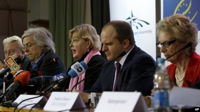 OSCE election observation mission special coordinator Walburga Habsburg Douglas, center, speaks to the media during a news conference in Kiev, Ukraine, Monday, Oct. 29, 2012. 
