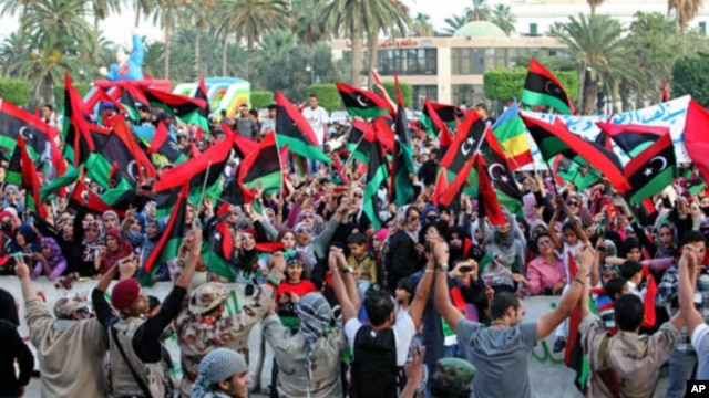 Libyans celebrate the liberation of Libya at Martyrs' Square in Tripoli, Libya, October 23, 2011.