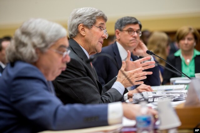 Secretary of State John Kerry, center, flanked by Treasury Secretary Jacob Lew, right, and Energy Secretary Ernest Moniz, testifies on Capitol Hill in Washington, Tuesday, July 28, 2015.