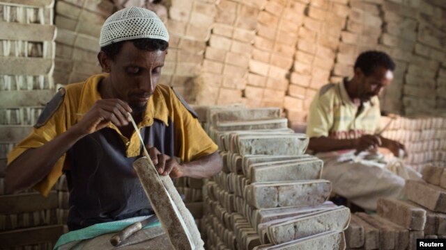 Men prepare bars of salt to be sold in the main market of the city of Mekele, northern Ethiopia, in this April 24, 2013, file photo.