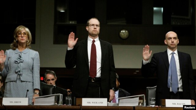 From left, former JPMorgan Chase executives Ina Drew and Peter Weiland, and the company's Acting Chief Risk Officer, Ashley Bacon, testify before Senate Homeland Security Investigations Subcommittee, Washington, March 15, 2013.