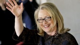 Hillary Rodham Clinton waves as she leaves the State Department, Feb. 1, 2013