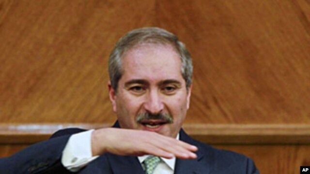 Jordan's Foreign Minister Nasser Judeh speaks to the media after his meeting with Israeli and Palestinian negotiators alongside international mediators trying to revive their stalled peace talks after more than a year of deadlock in Amman, January 3, 2012