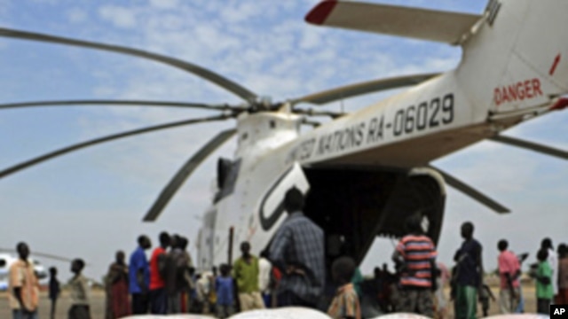 Relief food of the World Food Program is offloaded in Pibor, South Sudan, Jan 12, 2012.