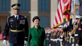 South Korean President Park Geun-hye reviews the troops during a full military honors parade to welcome her, Thursday, Oct. 15, 2015, at the Pentagon.