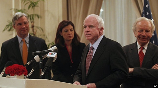 U.S. Senator John McCain (2nd R) speaks as Senators Joseph Lieberman, Sheldon Whitehouse (L) and Kelly Ayotte (2nd L) look on during a press briefing in Hanoi January 19, 2012, one of the stops on their visit to Asia.