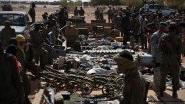 Weapons, munitions, seized from radical Islamist rebels are displayed at French army base in Gao, Mali,  Feb. 24, 2013