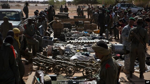 Weapons, munitions, seized from radical Islamist rebels are displayed at French army base in Gao, Mali,  Feb. 24, 2013