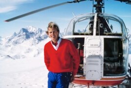 Francois-Xavier Bagnoud standing by a search-and-rescue helicopter.