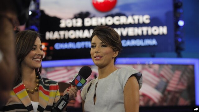 Actress Eva Longoria, right, is interviewed by Mariana Atencio of Univision on the floor of the Democratic National Convention in Charlotte, N.C.,  Sept. 6, 2012. 