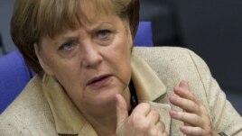 German Chancellor Angela Merkel attends a debate after delivering a statement on her government policies ahead of the upcoming G8 and NATO summits Bundestag, in Berlin, May 10, 2012.