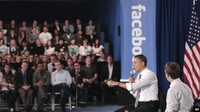 President Barack Obama and Facebook CEO Mark Zuckerberg take part in a town hall meeting to discuss reducing the national debt, April 20, 2011, at Facebook headquarters in Palo Alto, Calif.