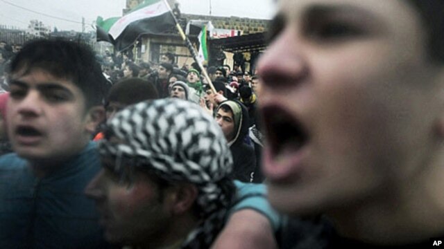 Protesters chant anti-government slogans in the village of Kansafra in the Jabal al-Zawiya region of the northern province of Idlib, December 9, 2011.
