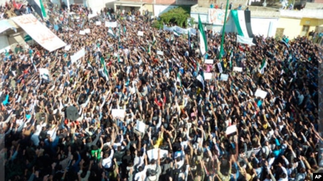 Demonstrators protest Syrian President Bashar al-Assad in Hula, Nov. 13, 2011.