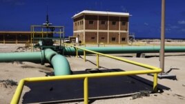 Pipelines run through the oil refinery at Zueitina near the northeastern Libyan town of Ajdabiyah, March 2011.