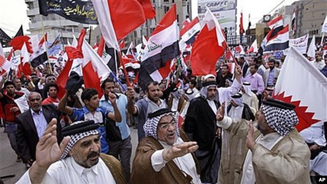 Iraqis chant slogans during a demonstration in solidarity with Bahraini protesters in Baghdad, April 23, 2011