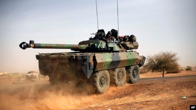 A French tank is seen heading north at the tail end of a 60-plus military convoy in Gao, northern Mali, February 6, 2013. 