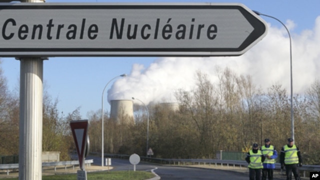 French gendarmes block the access at the nuclear plant in Nogent-sur-Seine after Greenpeace activists managed to sneak into the plant in what they said was a bid to highlight the dangers of atomic energy, December 5, 2011