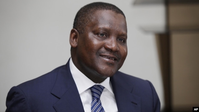 In this photo taken October 8, 2012, Nigerian billionaire businessman Aliko Dangote  attends  a global business environment meeting in Lagos, Nigeria.
