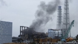Smoke rising from Unit 3 of the tsunami-stricken Fukushima Dai-ichi nuclear power plant, Okumamachi, Japan, March 21, 2011.