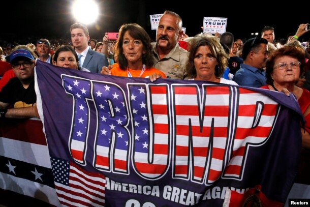 FILE - Supporters rally with Republican U.S. presidential nominee Donald Trump in Tampa, Florida, Oct. 24, 2016.