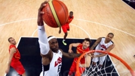 United States'  LeBron James (6) dunks against Spain during the men's gold medal basketball game at the 2012 Summer Olympics  in London on Sunday, Aug. 12, 2012. 