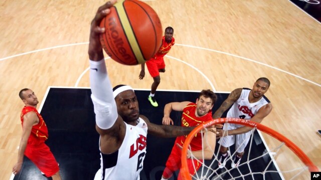 United States'  LeBron James (6) dunks against Spain during the men's gold medal basketball game at the 2012 Summer Olympics  in London on Sunday, Aug. 12, 2012. 