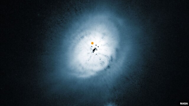 NASA/ESA Hubble Space Telescope view of the dust disc around the young star HD 100546. (ESO/NASA/ESA/Ardila et al.)