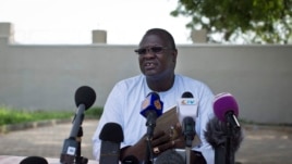 FILE - A July 26, 2013 photo shows former South Sudan VP Riek Machar speaking to the media to announce he will run for the presidency in 2015 against President Salva Kiir, who sacked Machar and his cabinet this week, Juba, South Sudan. 