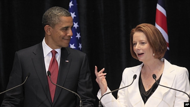 US President Barack Obama listens to Australian Prime Minister Julia Gillard during a joint press conference in Canberra, Australia, November 16, 2011.